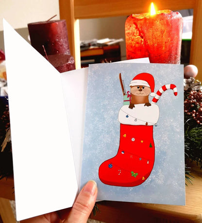 Klappkarte A6 Otter im Strumpf | Grußkarte Weihnachtskarte | Weihnachtsotter im Strumpf mit Geschenken